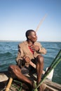 African man stearing a boat near Tofo Royalty Free Stock Photo